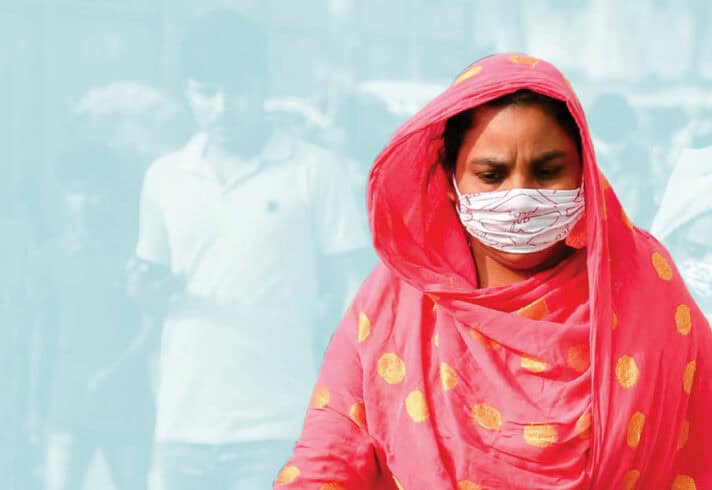Garment worker with a cloth mask