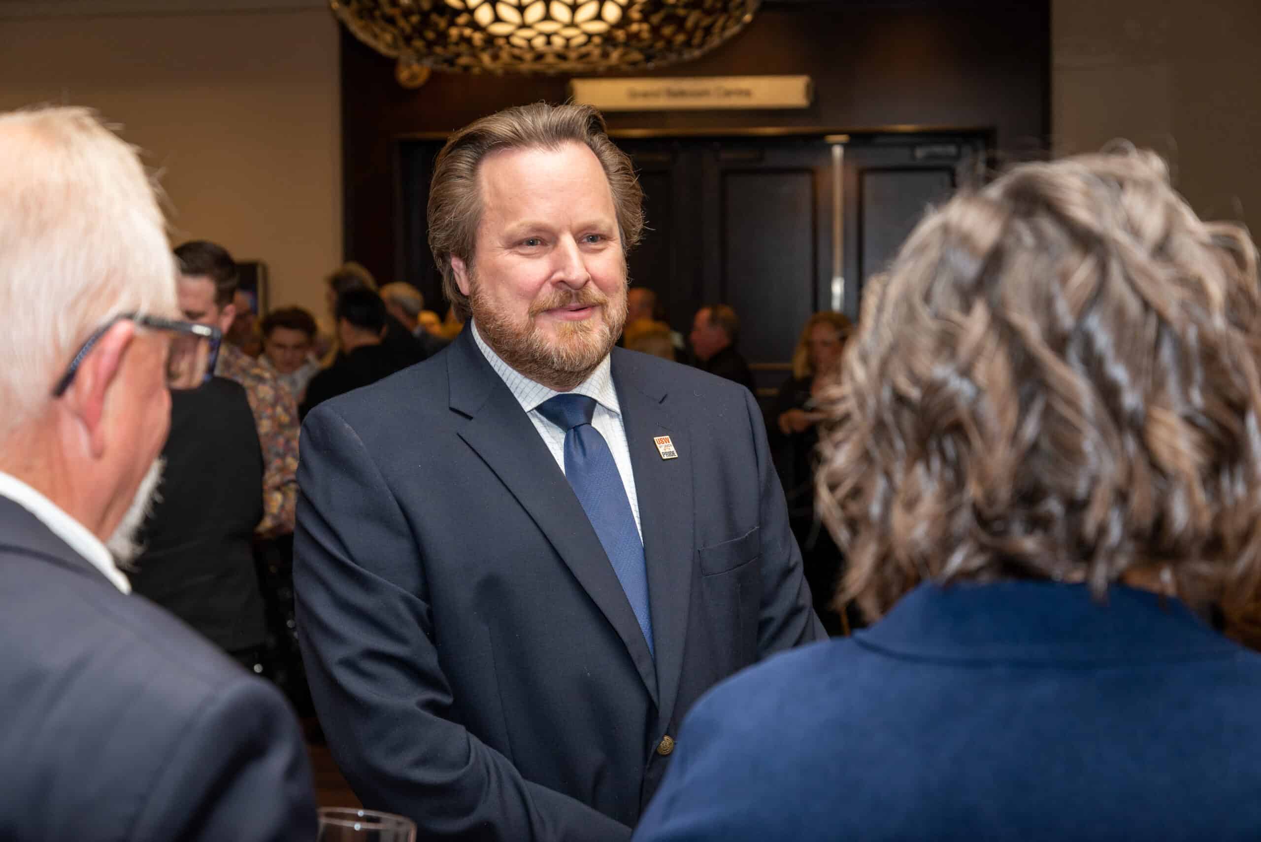 National Director Marty Warren shaking hands