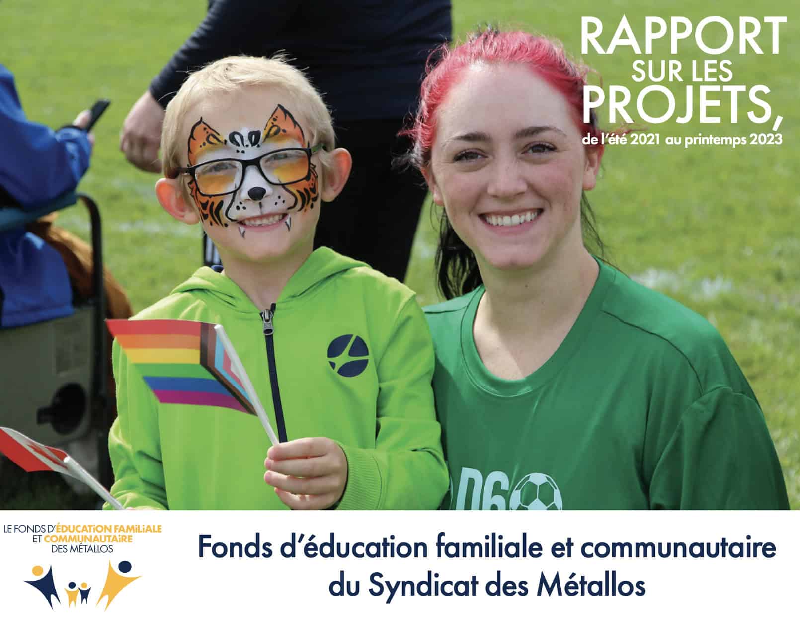 Two people, one of them is a kid, smiling while taking a photo in what seems to be a soccer field. thhey are both wearing green tops. The kid is holding a small LGBTG flag. There is atext on the top right corner saying project reports 2021-2023. More text at the bottom of the page that says USW Family & Community Eduction Fund.