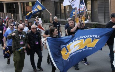 Steelworkers marching in the streets to demand action