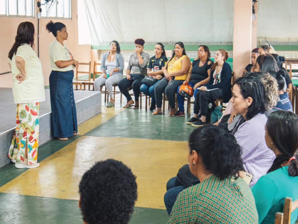 A person facilitating a workshop to a group of people.