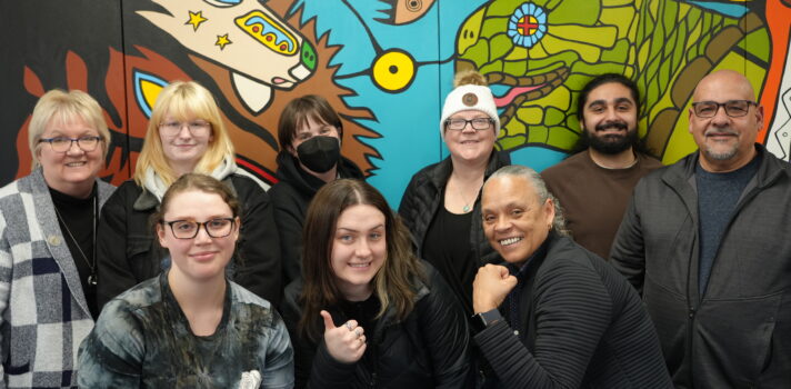 A group of people posing in front of the camera.